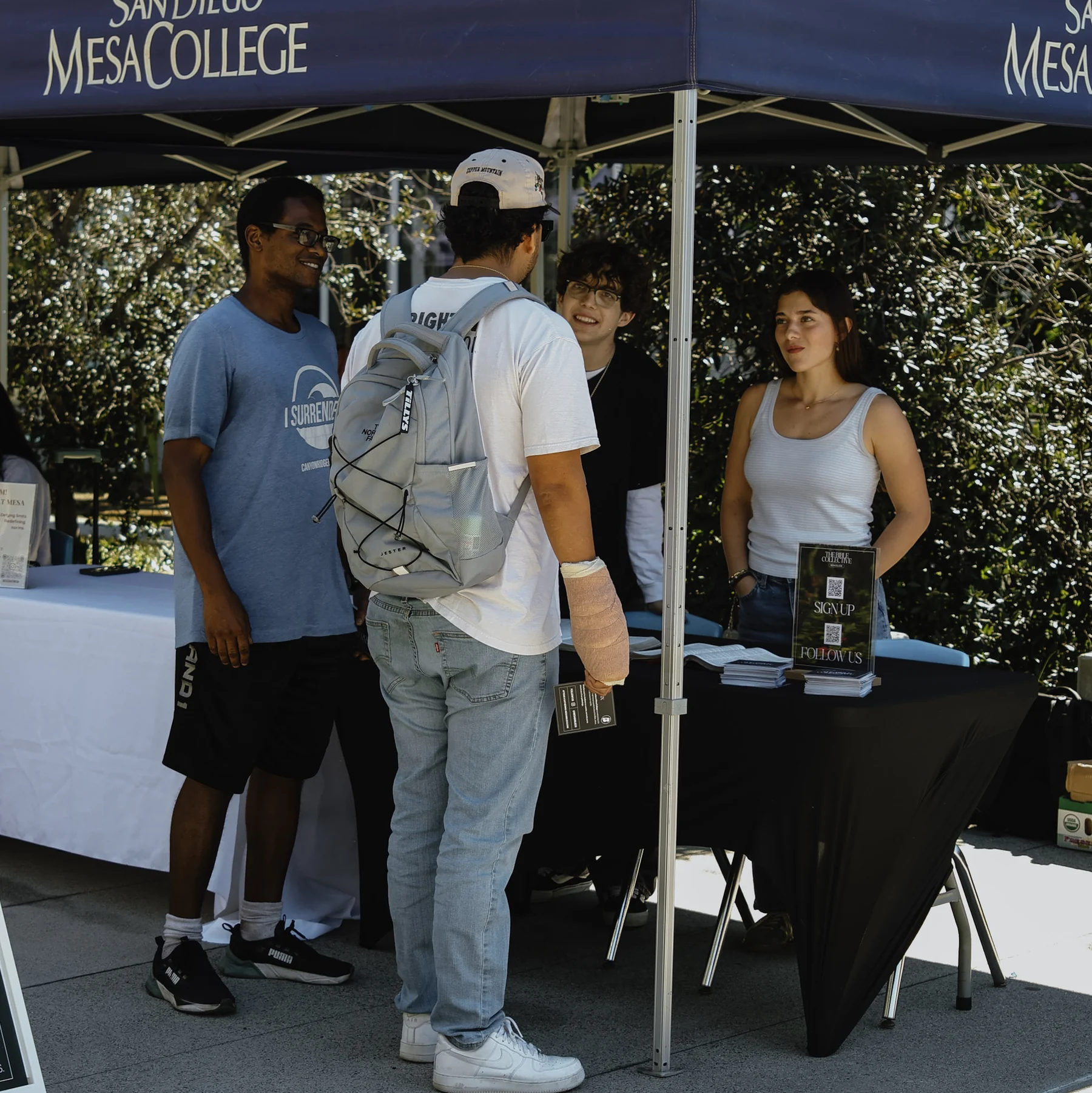 Students at a San Diego Mesa College outreach table